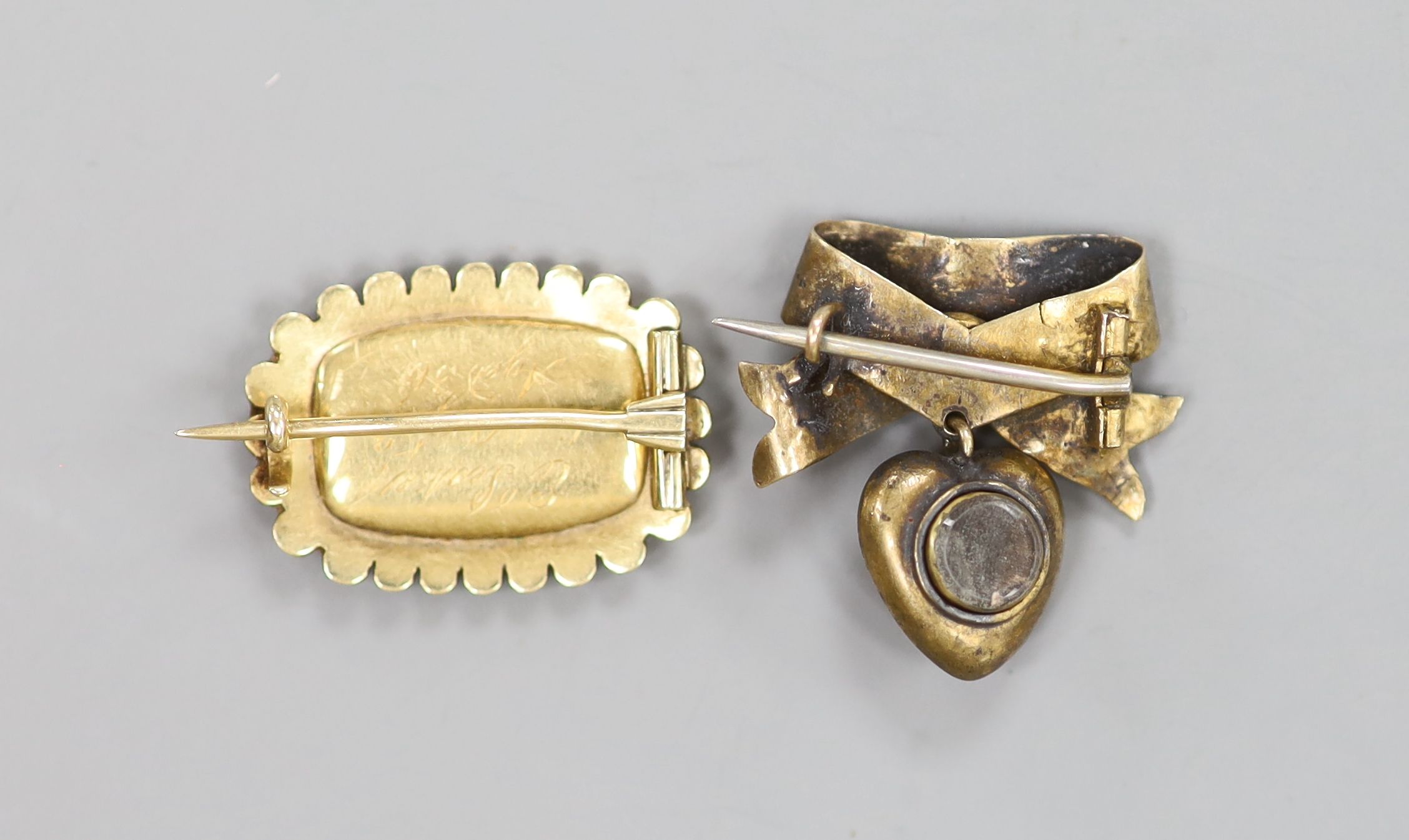 A Victorian yellow metal and seed pearl set mourning brooch, with engraved inscription and a brooch.